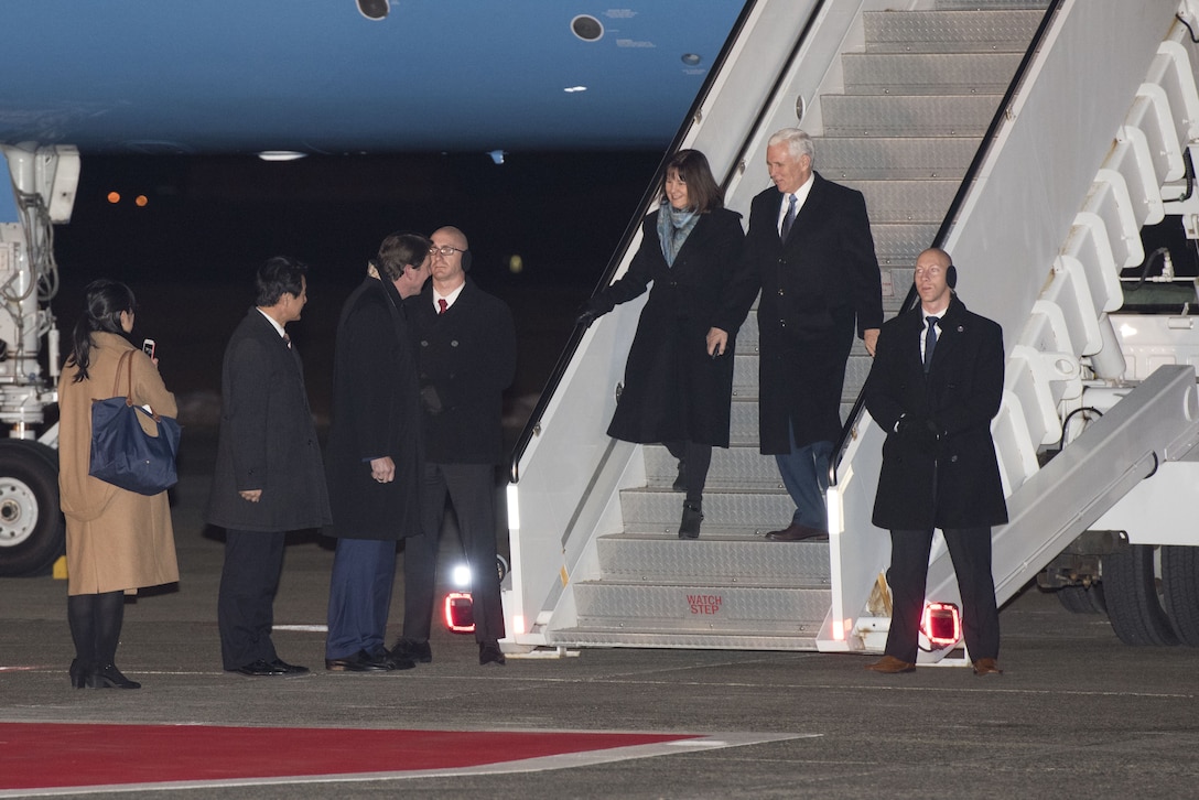 Vice President of the United States Michael R. Pence, accompanied by his wife Karen, are greeted by U.S. Ambassador to Japan Bill Hagerty upon their arrival to Yokota Air Base, Japan, Feb. 6, 2018.