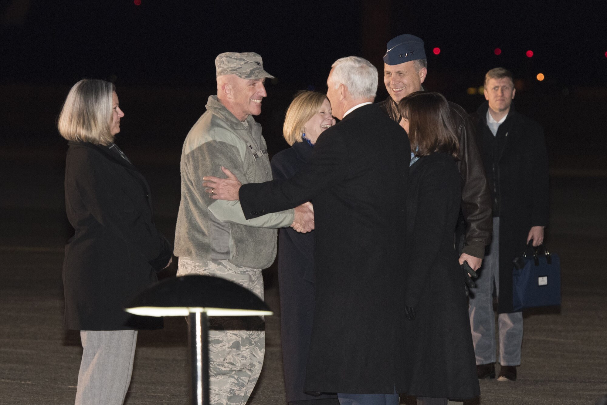 Col. Kenneth E. Moss, 374th Airlift Wing commander greets Vice President of the United States Michael R. Pence during his arrival at Yokota Air Base, Japan, Feb. 6, 2018.