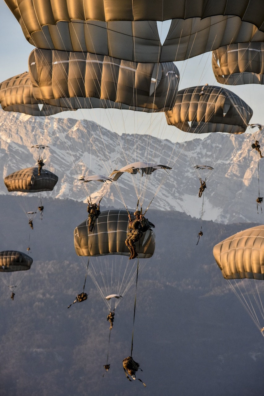 Hundreds of 173rd Airborne Brigade paratroopers conduct a tactical airborne insertion exercise onto Juliet Drop Zone in northern Italy, Jan. 24, 2018. Army photo by Lt. Col. John Hall