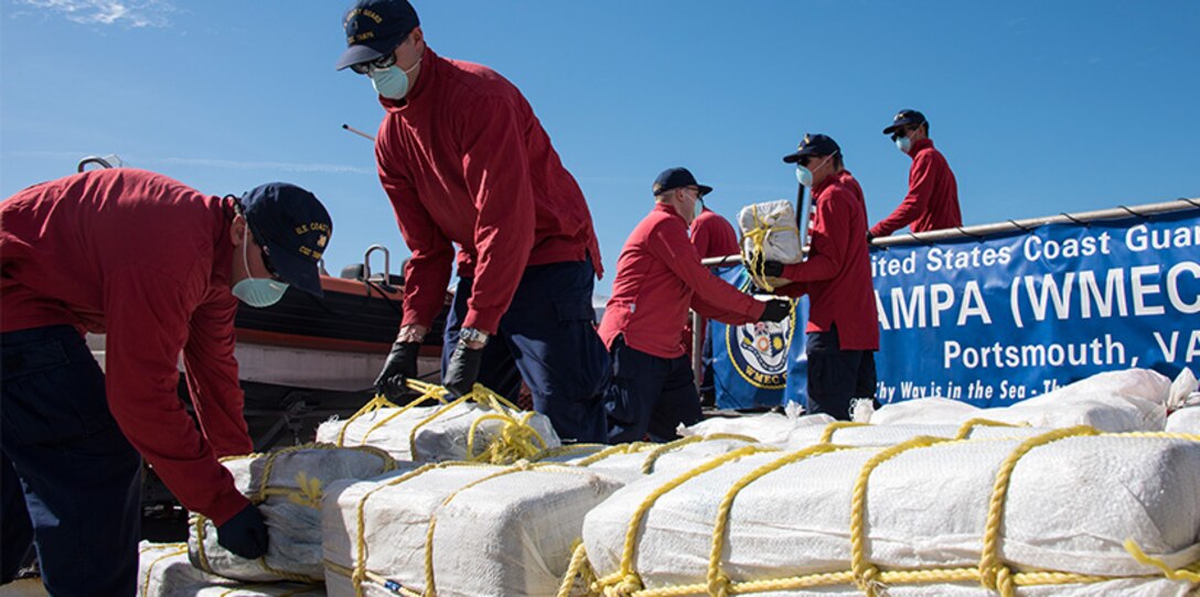 The crew of the Coast Guard Cutter Tampa offloads nearly two tons of cocaine Friday, Feb. 2, 2018