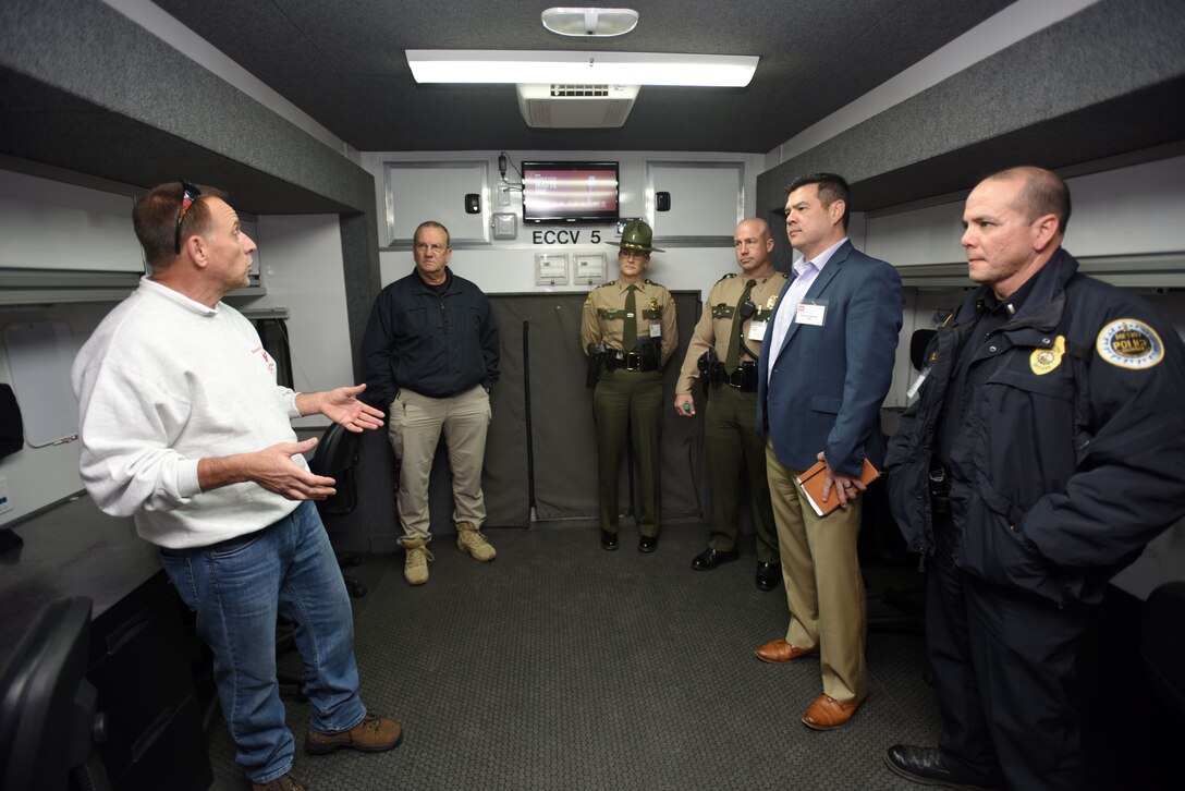 Jerry Breznican (Left), U.S. Army Corps of Engineers Nashville District Emergency Management chief, briefs first responders in an Emergency Command and Control Vehicle during First Responders Day at Old Hickory Dam in Old Hickory, Tenn., Feb. 1, 2018. (USACE photo by Lee Roberts)