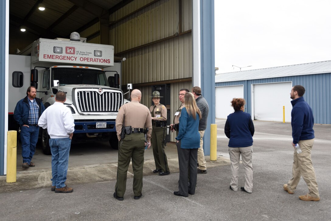 Jerry Breznican (Second from Left), U.S. Army Corps of Engineers Nashville District Emergency Management chief, briefs first responders in front of an Emergency Command and Control Vehicle during First Responders Day at Old Hickory Dam in Old Hickory, Tenn., Feb. 1, 2018. (USACE photo by Lee Roberts)