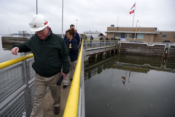 Tony Bivens, U.S. Army Corps of Engineers Nashville District Middle Tennessee Area manager, leads first responders across the upper gates at Old Hickory Lock in Old Hickory, Tenn., during First Responders Day Feb. 1, 2018. (USACE photo by Lee Roberts)