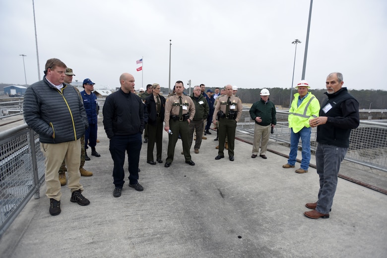 Joe Conatser (Right), U.S. Army Corps of Engineers Nashville District power plant manager at Old Hickory Dam, leads a tour of first responders on top of the dam during First Responders Day at the project on the Cumberland River in Old Hickory, Tenn., Feb. 1, 2018. (USACE photo by Lee Roberts)