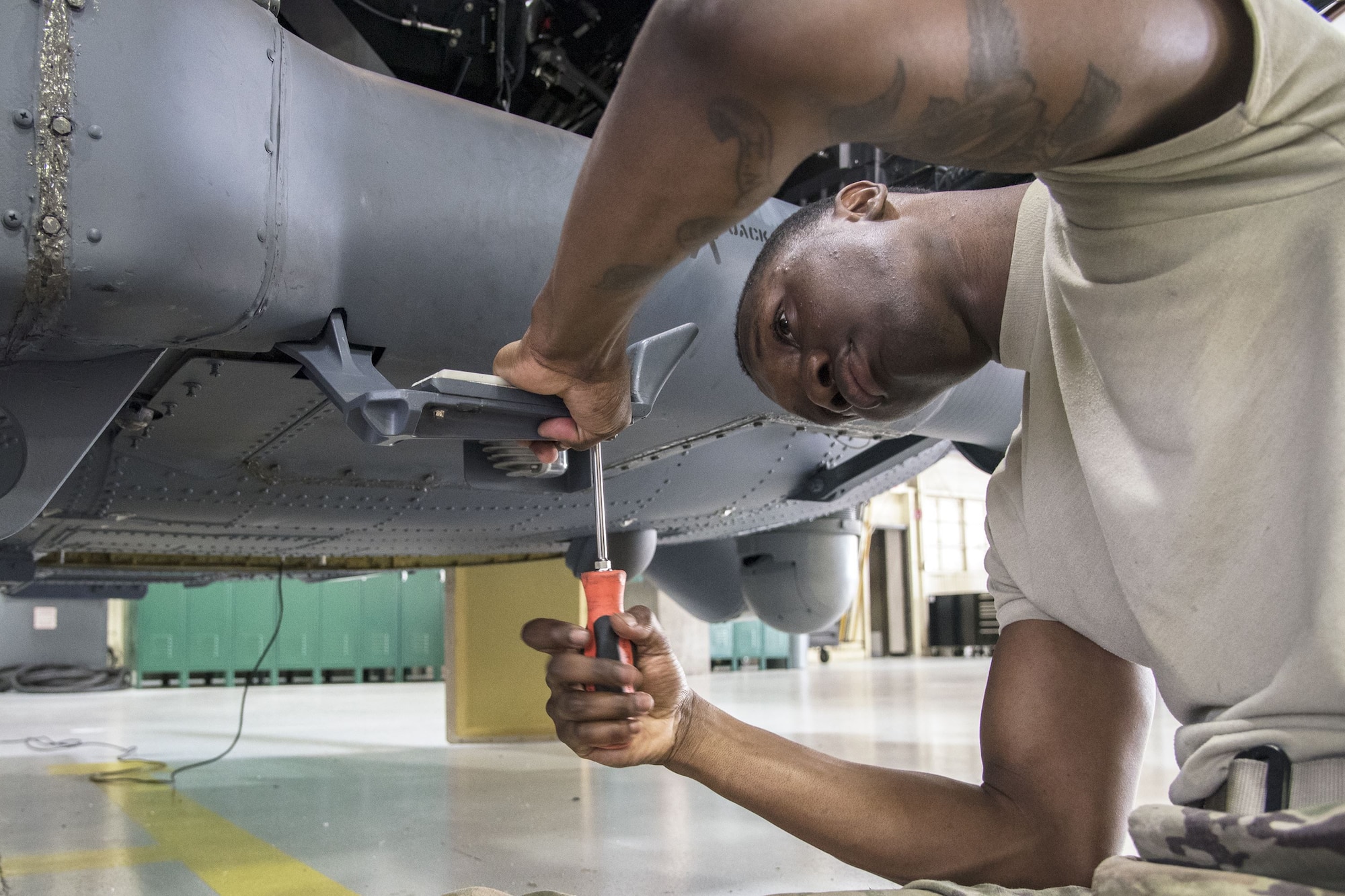Airman 1st Class Marlon Natty, 723d Aircraft Maintenance Squadron (AMXS) HH-60G Pave Hawk crew chief, tightens a bolt, Jan. 22, 2018, at Moody Air Force Base, Ga. From 16-25 Jan., Airmen from the 723d AMXS performed 216 hours of maintenance on an HH-60 after it returned to Moody following 350 days of depot maintenance at Naval Air Station (NAS) Jacksonville. While at NAS Jacksonville, the HH-60 underwent a complete structural overhaul where it received new internal and external components along with repairs and updated programming. (U.S. Air Force photo by Airman Eugene Oliver)