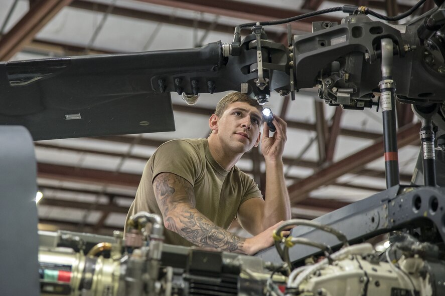 Senior Airman Joshua Herron, 723d Aircraft Maintenance Squadron (AMXS) HH-60G Pave Hawk crew chief, examines the propeller of an HH-60, Jan. 22, 2018, at Moody Air Force Base, Ga. From 16-25 Jan., Airmen from the 723d AMXS performed 216 hours of maintenance on an HH-60 after it returned to Moody following 350 days of depot maintenance at Naval Air Station (NAS) Jacksonville. While at NAS Jacksonville, the HH-60 underwent a complete structural overhaul where it received new internal and external components along with repairs and updated programming. (U.S. Air Force photo by Airman Eugene Oliver)