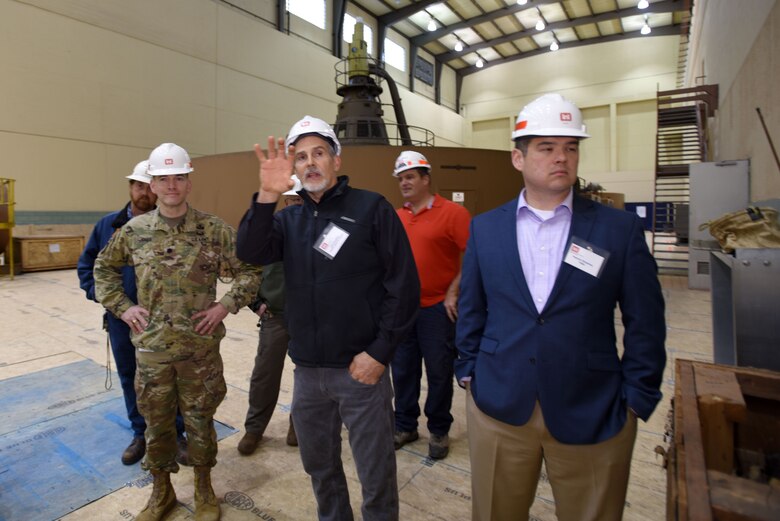 Joe Conatser (Holding Hand Up), U.S. Army Corps of Engineers Nashville District power plant manager at Old Hickory Dam, answers questions from a group of first responders in the hydropower plant during First Responders Day at the project on the Cumberland River in Old Hickory, Tenn., Feb. 1, 2018. Lt. Col. Cullen Jones (In uniform) and Patrick Sheehan (Blue Blazer), Tennessee Emergency Management Agency director, participated in this tour. (USACE photo by Lee Roberts)