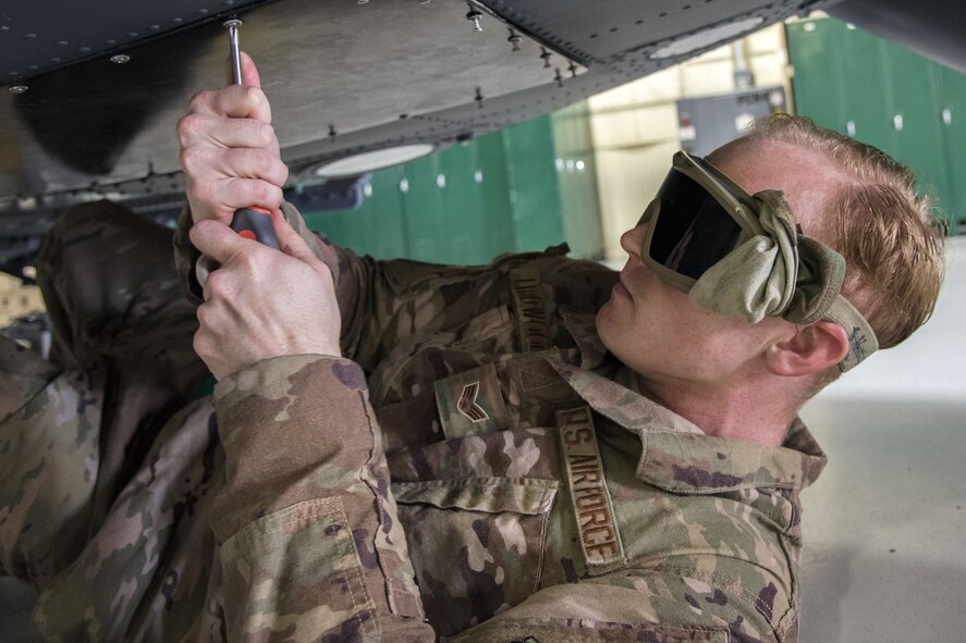Senior Airman Justin Littlewood, 723d Aircraft Maintenance Squadron (AMXS) avionics technician, bolts a quad bay onto the bottom of an HH-60G Pave Hawk, Jan. 22, 2018, at Moody Air Force Base, Ga. From 16-25 Jan., Airmen from the 723d AMXS performed 216 hours of maintenance on an HH-60 after it returned to Moody following 350 days of depot maintenance at Naval Air Station (NAS) Jacksonville. While at NAS Jacksonville, the HH-60 underwent a complete structural overhaul where it received new internal and external components along with repairs and updated programming. (U.S. Air Force photo by Airman Eugene Oliver)