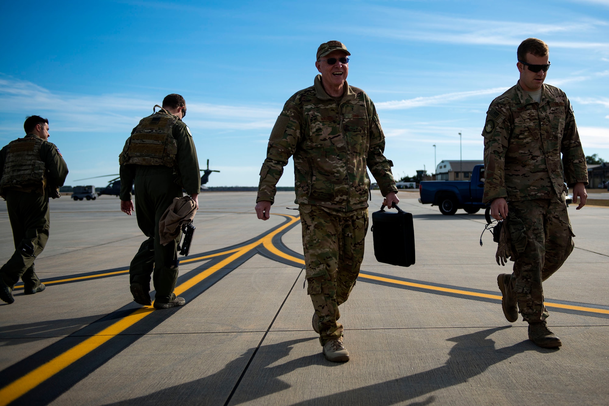 Pilots, maintainers walk along the flight line, Jan. 16, 2018, at Moody Air Force Base, Ga.  From 16-25 Jan., Airmen from the 723d AMXS performed 216 hours of maintenance on an HH-60 after it returned to Moody following 350 days of depot maintenance at Naval Air Station (NAS) Jacksonville. While at NAS Jacksonville, the HH-60 underwent a complete structural overhaul where it received new internal and external components along with repairs and updated programming. 
(U.S. Air Force photo by Airman 1st Class Erick Requadt)