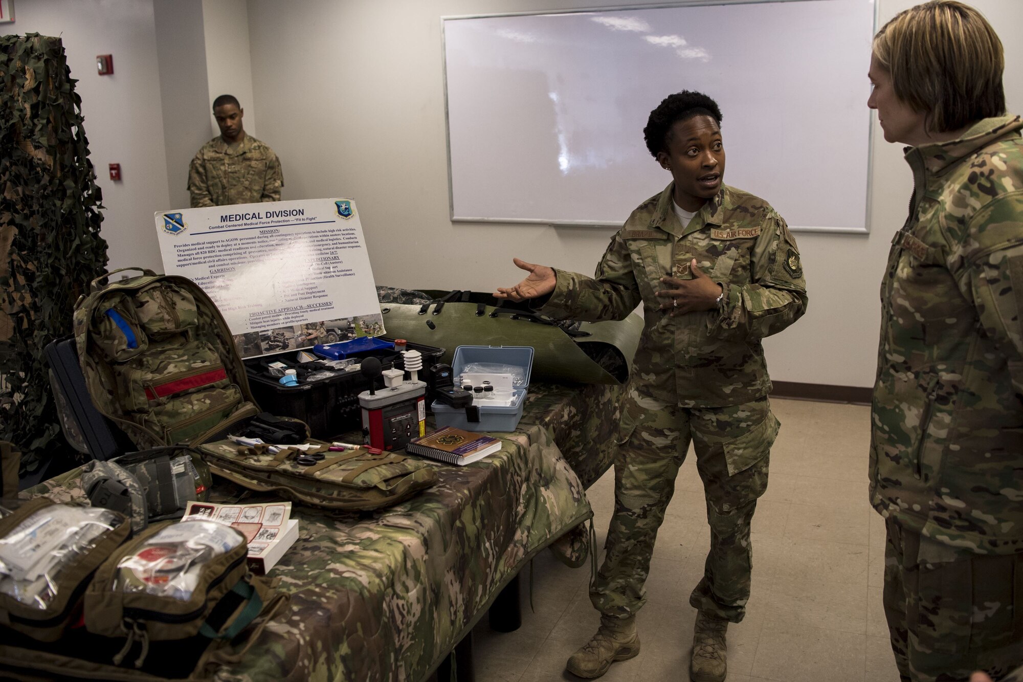 Tech. Sgt. Leticia Brazil, 823d Base Defense Squadron independent duty medical technician, displays her equipment and describes her mission to Col. Jennifer Short, 23d Wing commander, during a capabilities demonstration, Feb. 5, 2018, at Moody Air Force Base, Ga. The immersion was designed to give the 23d Wing’s leadership a better understanding of the 820th Base Defense Group’s mission, capabilities and training needs. (U.S. Air Force photo by Senior Airman Daniel Snider)