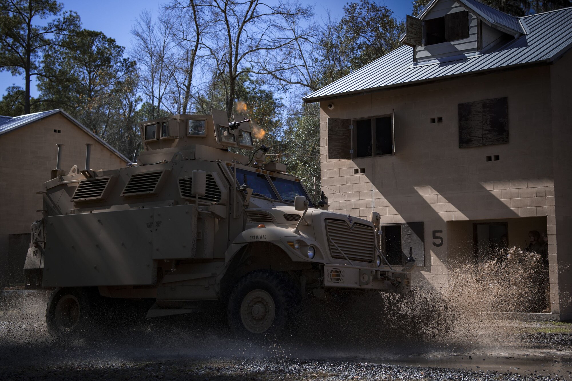 Airmen assigned to the 820th Base Defense Group drive a mine-resistant, ambush-protected vehicle during a capabilities demonstration, Feb. 5, 2018, at Moody Air Force Base, Ga. The immersion was designed to give the 23d Wing’s leadership a better understanding of the 820th BDG’s mission, capabilities and training needs. (U.S. Air Force photo by Senior Airman Daniel Snider)