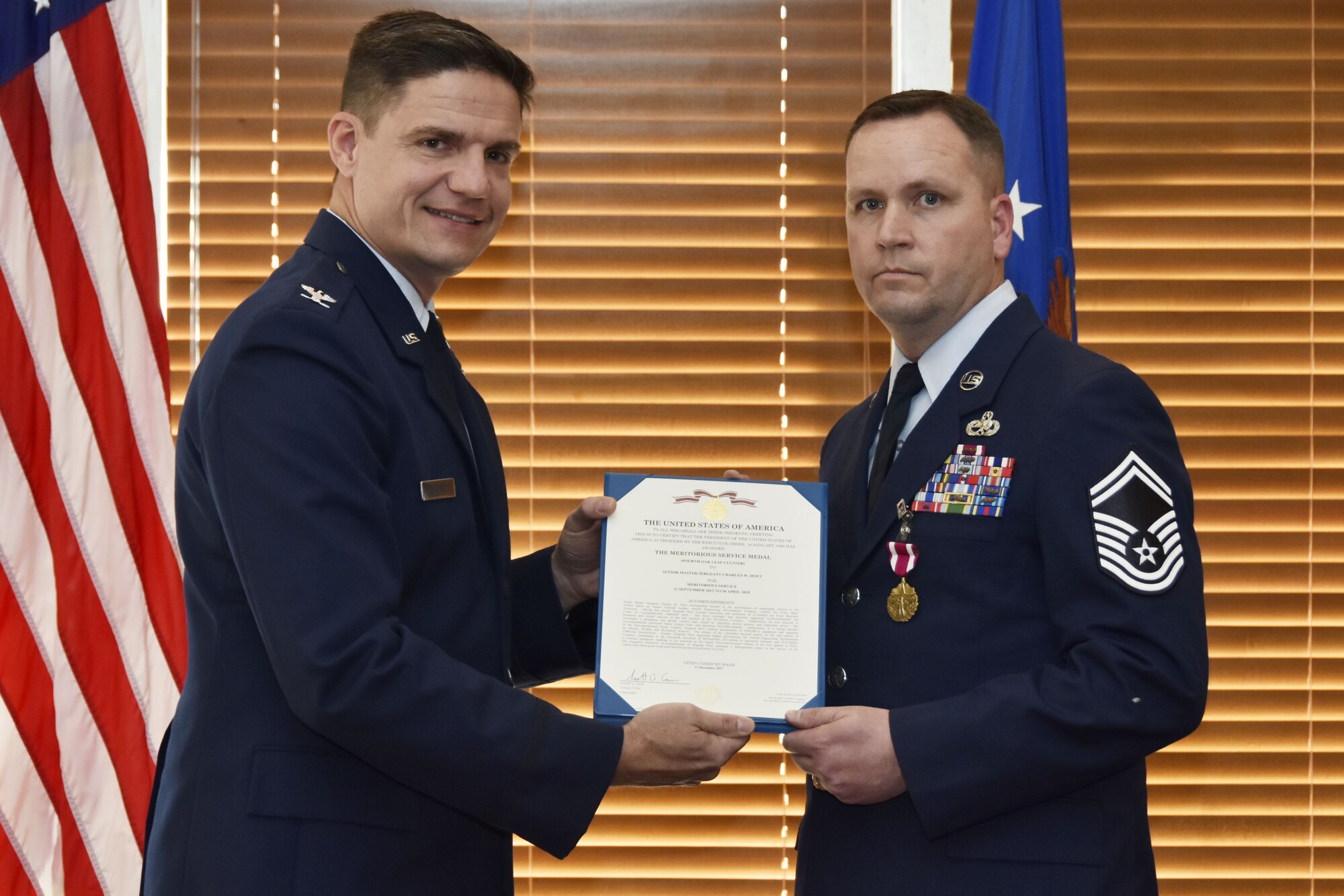During his retirement ceremony at the Arnold Lakeside Center Jan. 19, Senior Master Sgt. Charles Hoyt, right, receives the Meritorious Service Medal for meritorious service from retired Col. Rodney Todaro. Hoyt retired after serving as the Arnold Air Force Base Senior Enlisted Leader since September 2015. As Senior Enlisted Leader, he advised the commander on training, readiness, effective utilization and development of all Airmen. He ensured that Airmen understood and executed the commander's policies. Additionally, he maintained relationships with local civilian community leaders and provided recommendations to the Complex division chiefs and key staff members on behalf of the enlisted force at Arnold AFB. (U.S. Air Force photo/Rick Goodfriend)