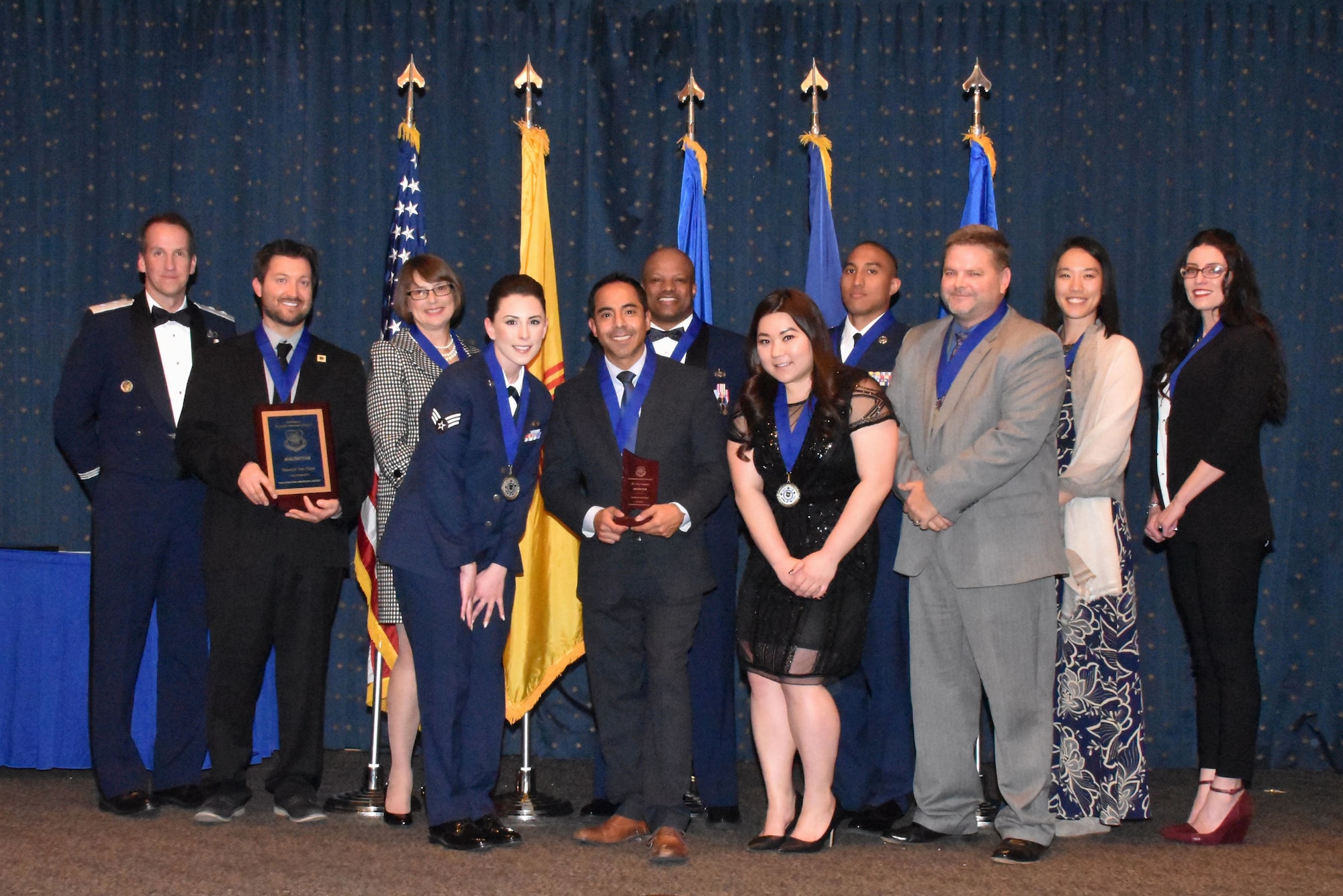 The Air Force Nuclear Weapons Center recognized its annual award winners at a ceremony Jan. 25 at the Mountain View Club, Kirtland AFB, New Mexico.  Pictured left to right: Maj. Gen. Shaun Morris, AFNWC commander, David Bax, Leslie Remy, Senior Airman Darian Bolles, Ray Campos, Master Sgt. Jerry Chandler, Jessica Keomatu, Tech. Sgt. Kamuela Kalilikane, Wesley Treadway, Stephanie Mma and Megan Wheeler.