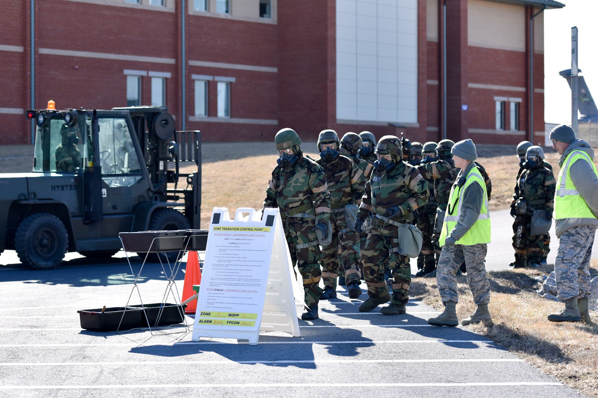 Airmen prepare to enter a zone transition control point during a readiness exercise at the 167th Airlift Wing, West Virginia Air National Guard, Feb. 3.
