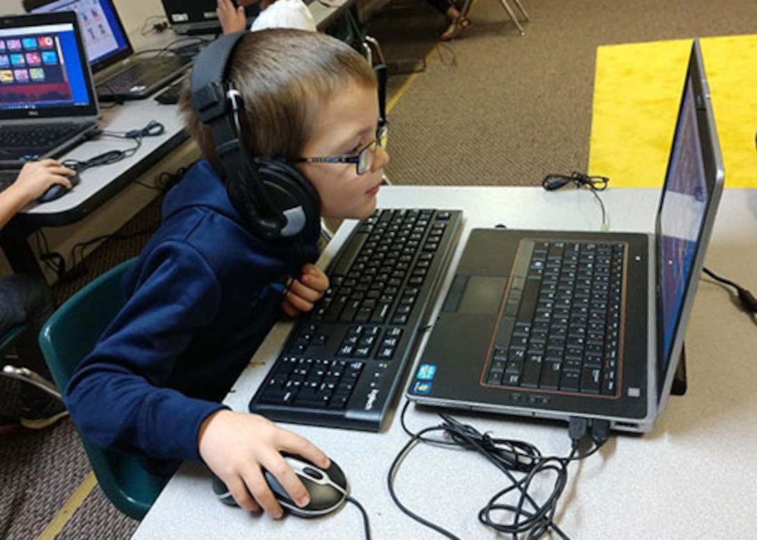 A student at San Antonio, Texas' Royal Point Academy learns on a former computer that came through DLA Disposition Services at San Antonio and DoD's Computers for Learning program. Photo provided by Royal Point Academy
