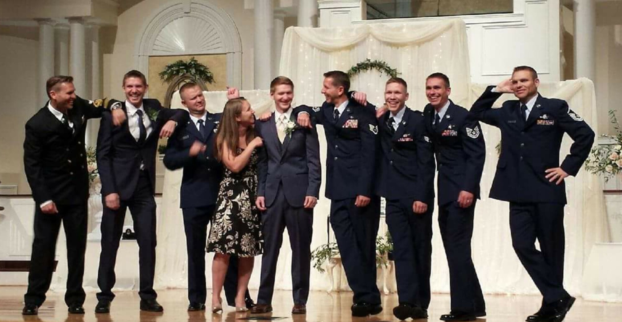 All nine Baumgartner siblings pose for a photo at their youngest brother, Stephen's, wedding.