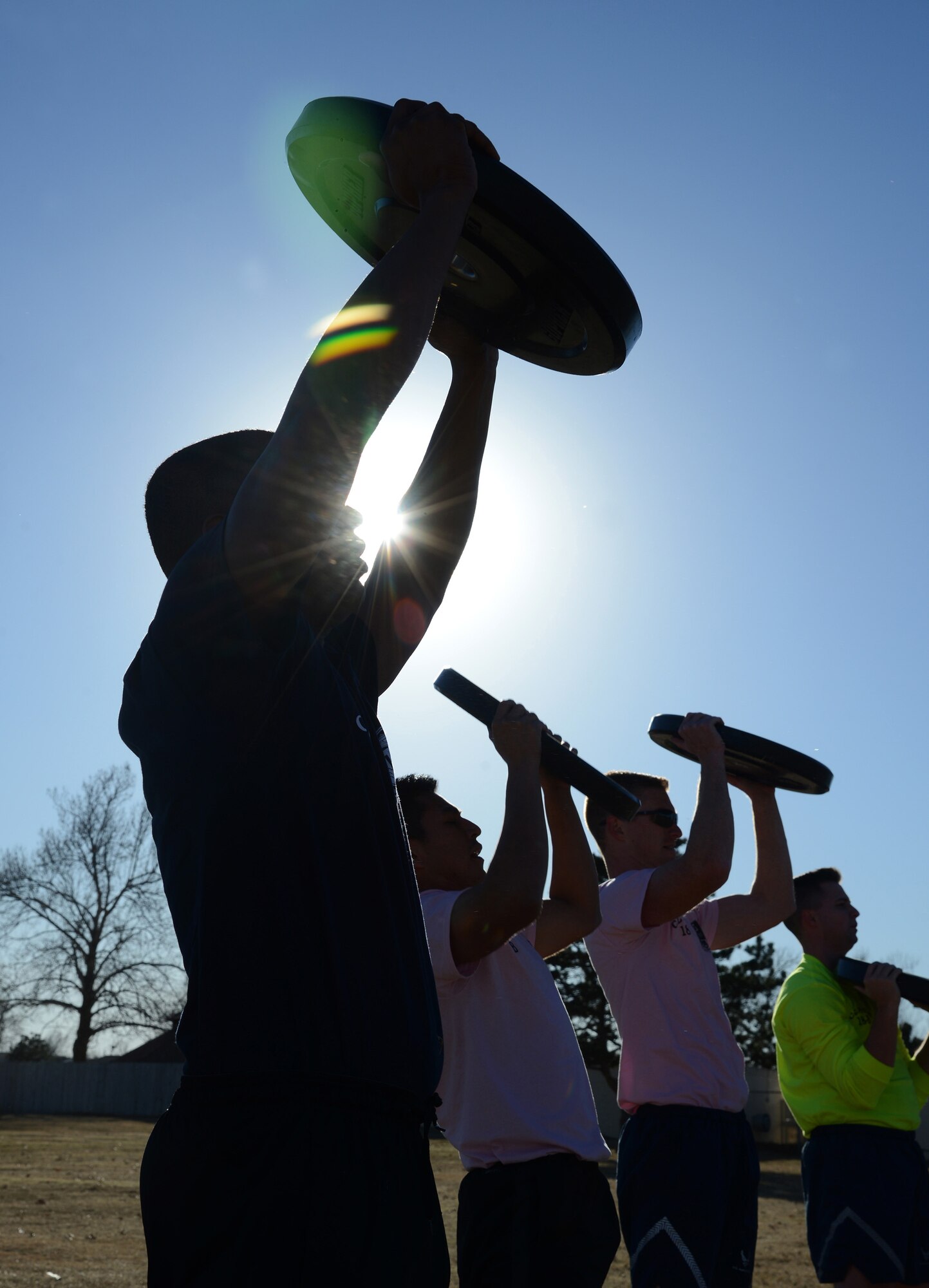 2,000 pounds of weights came as part of the Airman Leadership Combat Cube, which the Airman can use to lift with bars or individually, as shown.
