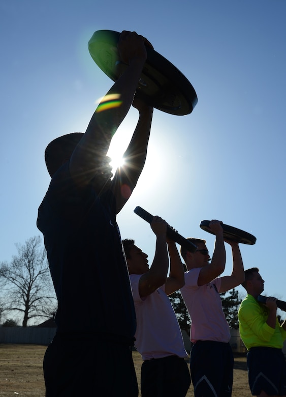 2,000 pounds of weights came as part of the Airman Leadership Combat Cube, which the Airman can use to lift with bars or individually, as shown.