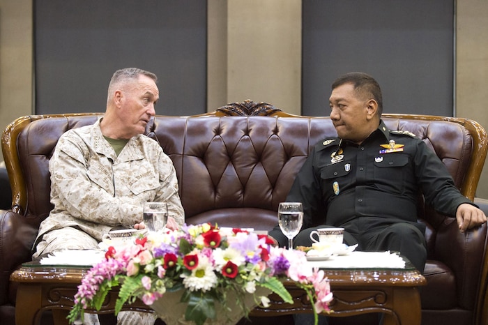 U.S and Thai defense leaders sit together and talk in Bangkok.