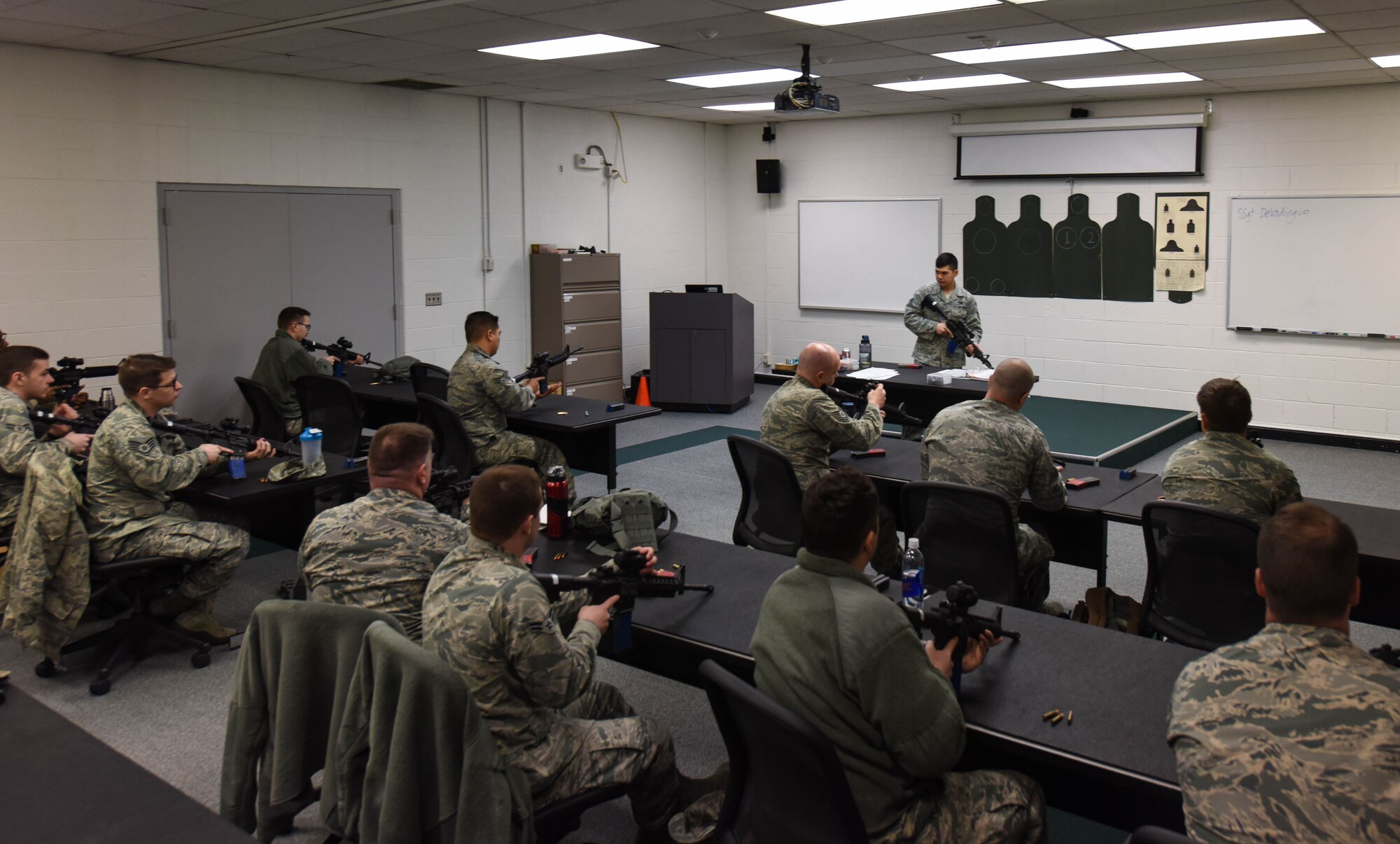 Staff Sgt. Dan Antonio Deldingco, 627th Security Forces Squadron Combat Arms Training and Maintenance instructor, teaches a class on how to properly handle and use an M-4 carbine at Joint Base Lewis-McChord, Wash., Jan. 31, 2018.