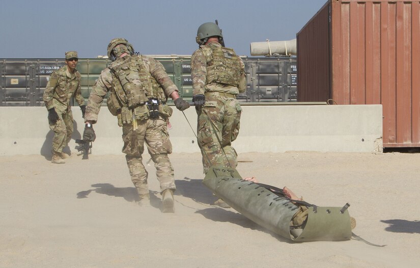 Soldiers transport simulated casualty