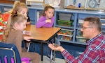 Second-grade students at Fort Sam Houston Elementary School observe a tarantula being handled by Dr. William Miller, U.S. Army Environmental Command entomologist, Jan. 31. Miller came to the gifted and talented program class of Laura Lamoureux to talk to the children about insects and arachnids, including their characteristics and how they can grow from an immature form to an adult.