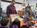 Dr. William Miller, U.S. Army Environmental Command entomologist, shows a display case of insects to second graders and their teacher, Laura Lamoureux, in the gifted and talented program at Fort Sam Houston Elementary School Jan. 31.