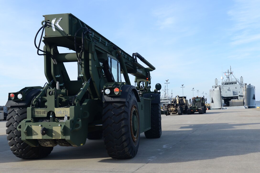 The U.S. Army's 149th Seaport Operations Company, 10th Battalion, 7th Transportation Brigade (Expeditionary), prepares vehicles for training on Fort Eustis' 3rd Port at Joint Base Langley-Eustis, Va., Feb. 1, 2018. Members of the 149th SOC practiced real-world scenarios in preparation for maritime operations. (U.S. Air Force photo by Airman 1st Class Monica Roybal)