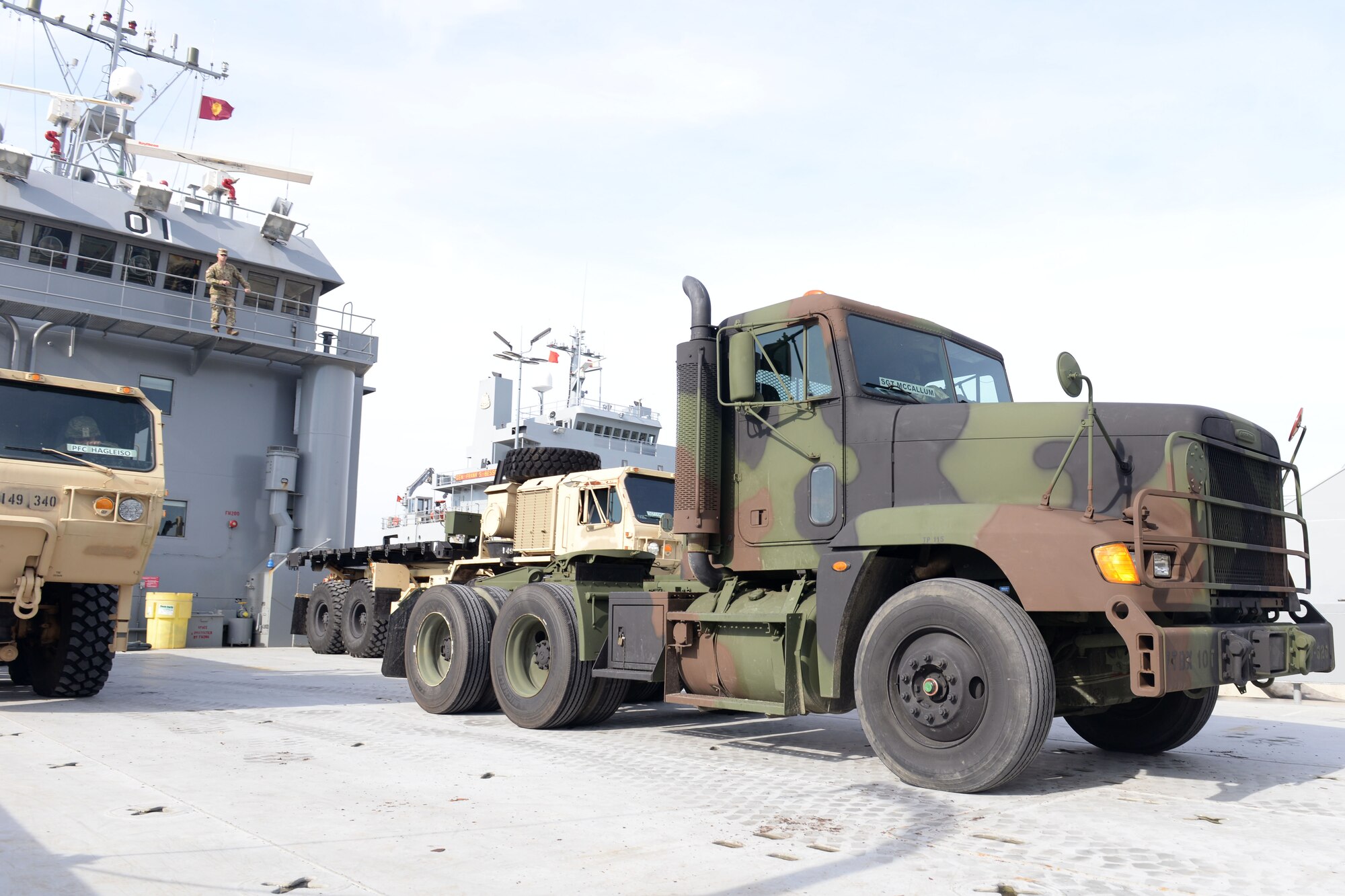 U.S. Army's 149th Seaport Operations Company, 10th Battalion, 7th Transportation Brigade (Expeditionary), conducts a roll-on, roll-off training exercise on Fort Eustis' 3rd Port at Joint Base Langley-Eustis, Va., Feb. 1, 2018. Multiple vehicles were guided onto a vessel while a safety officer directed vehicle movements from above. (U.S. Air Force photo by Airman 1st Class Monica Roybal)