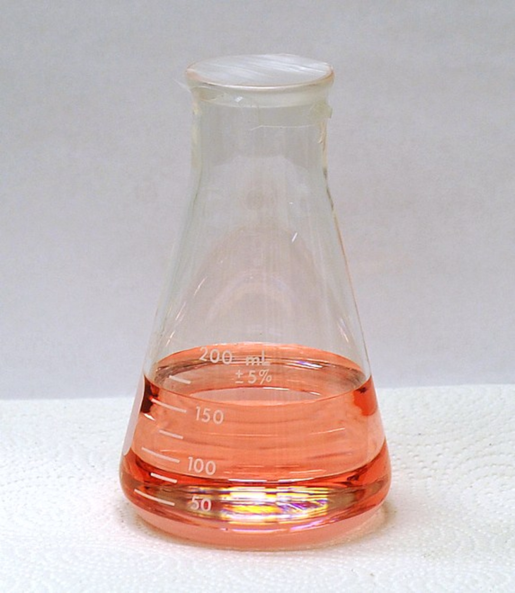 A sample of AF-M315E, a green alternative to hydrazine that was developed by the AFRL Aerospace Systems Directorate Propulsion Branch. AFRL recently licensed the propellant to Digital Solid State Propulsion for commercialization. (Air Force photo.)