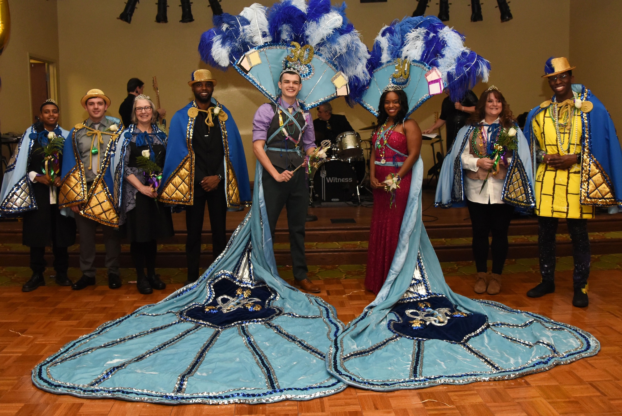 The 2018 Krewe of Medics Royalty Court pose for a photo during the 30th Annual Krewe of Medics Mardi Gras Ball at the Bay Breeze Event Center Feb. 3, 2018, on Keesler Air Force Base, Mississippi. The Krewe of Medics hosts a yearly ball to give Keesler Medical Center personnel a taste of the Gulf Coast and an opportunity to experience a traditional Mardi Gras. The theme for this year's ball was Read It-Be It. (U.S. Air Force photo by Kemberly Groue)