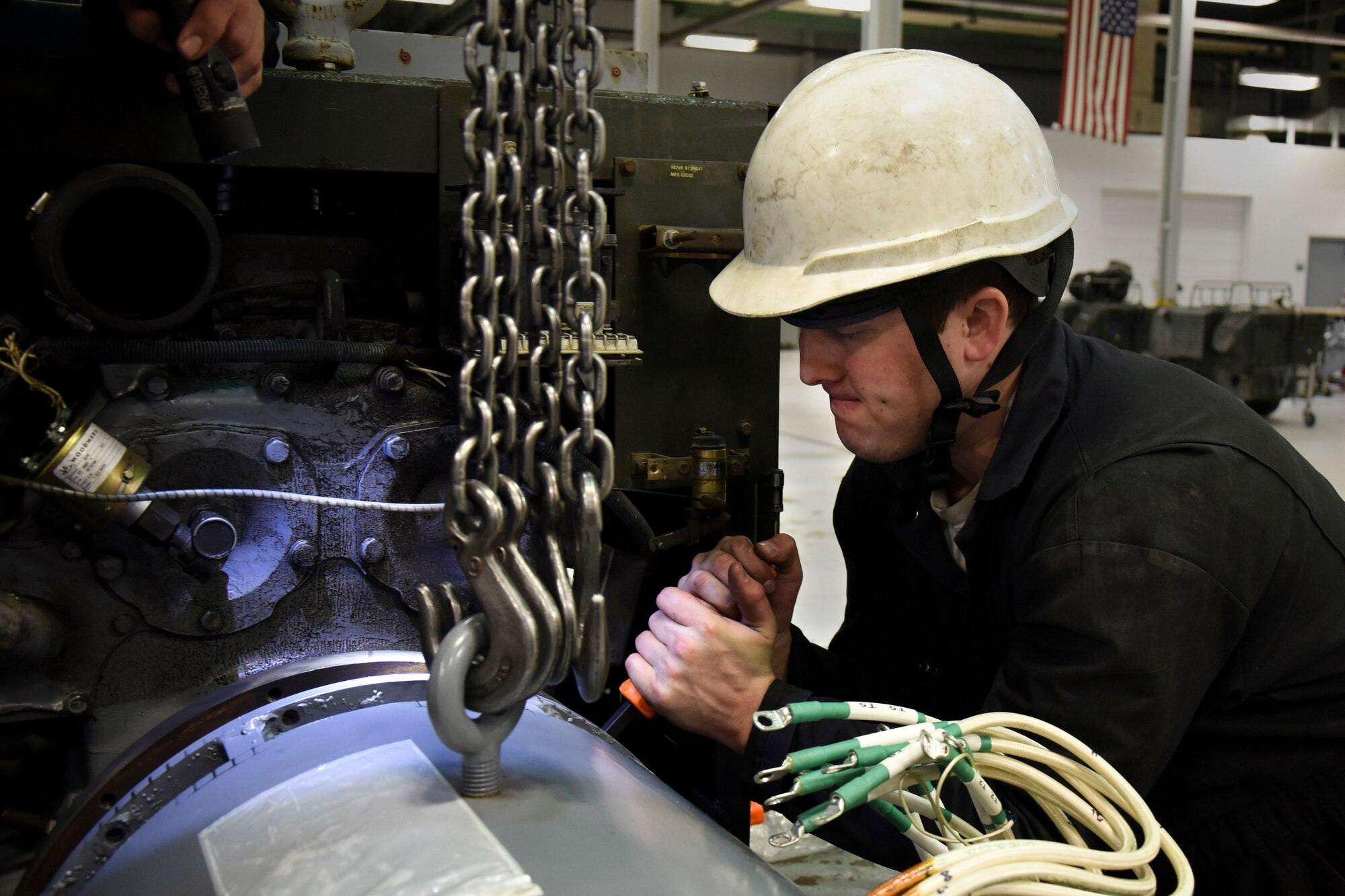 Senior Airman Dustin Holmes, 5th Maintenance Squadron aerospace ground equipment technician, rotates a fan on a diesel generator at Minot Air Force Base, N.D., Jan. 24, 2018. Diesel generators are used to conduct and distribute power to the B-52H Stratofortress. (U.S. Air Force photo by Senior Airman Jessica Weissman)