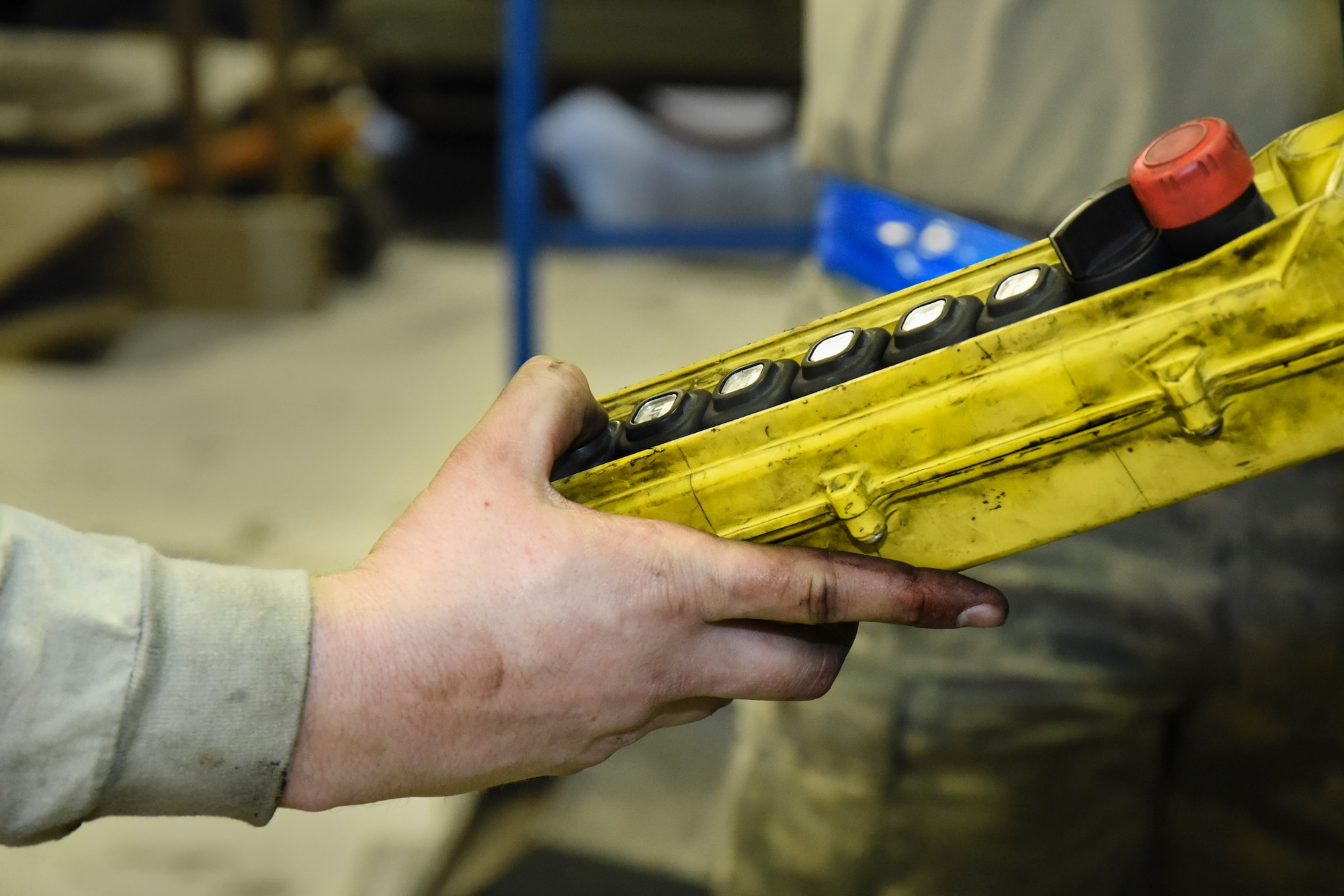 Senior Airman Dustin Holmes, 5th Maintenance Squadron aerospace ground equipment technician, lowers a hoist at Minot Air Force Base, N.D., Jan. 24, 2018. Aerospace ground equipment technicians are responsible for delivery, maintenance and inspection of equipment used on the flight line. (U.S. Air Force photo by Senior Airman Jessica Weissman)