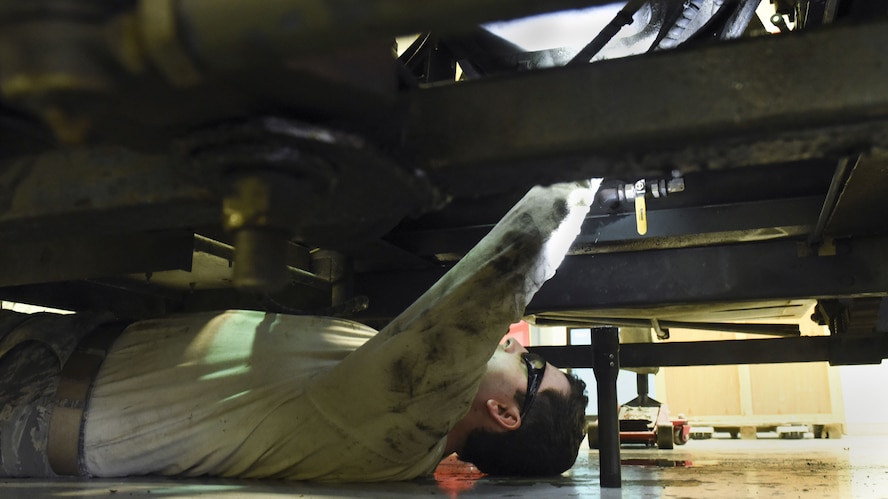 Senior Airman Dustin Holmes, 5th Maintenance Squadron aerospace ground equipment technician, removes a bolt on a diesel generator at Minot Air Force Base, N.D., Jan. 24, 2018. Diesel generators are used to conduct and distribute power to the B-52H Stratofortress. (U.S. Air Force photo by Senior Airman Jessica Weissman)