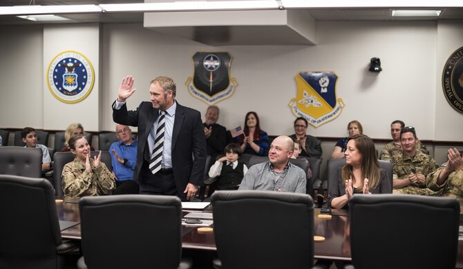 Everett Young introduces himself at a U.S. Citizenship and Immigration Services naturalization ceremony at Cannon Air Force Base, N.M., Feb. 2, 2018. Young hails from Scotland, and earned his U.S. citizenship at the event. (U.S. Air Force photo by Senior Airman Lane T. Plummer)