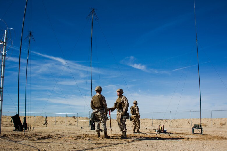 Marines with Marine Wing Communication Squadron 38 dig trenches for wires at Camp Wilson aboard the Marine Corps Air Ground Combat Center, Twentynine Palms, Calif., January 22, 2018, as a part of Integrated Training Exercise 2-18. The purpose of ITX is to create a challenging, realistic training environment that produces a combat-ready forces capable of operating as an integrated MAGTF. (Photo provided by courtesy asset)