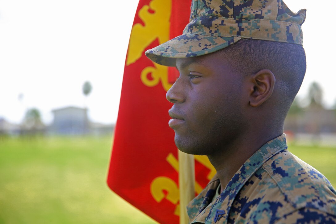 Cpl. Wallace C. Funchess, 3rd Battalion 11th Marine Regiment, presents the guidon for 1st platoon  during the post and relief ceremony at the commanding general’s lawn aboard the Marine Corps Air Ground Combat Center Twentynine Palms, Calif., Jan. 18, 2018. Sgt. Maj. Earl D. Budd, off going sergeant major, 3/11, relinquished his post as battalion Sergeant Major to Sgt. Maj. Travis L. Debarr, incoming sergeant major, 3/7, MCAGCC. (U.S. Marine Corps Photo by LCpl. Jennessa Davey)