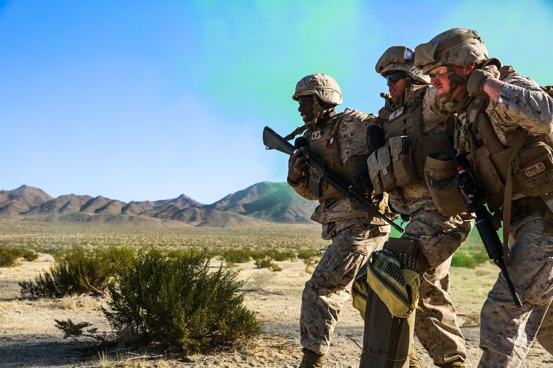 A simulated casualty is escorted by members of 2nd Battalion, 3rd Marine Regiment to a landing zone for medical attention during Integrated Training Exercise 2-18 aboard Marine Air Ground Combat Center, Twentynine Palms, Calif., Jan. 24, 2018.  The purpose of ITX is to create a challenging, realistic training environment that produces combat-ready forces capable of operating as an integrated MAGTF. (U.S. Marine Corps Photo by Lance Cpl. Conner Downey)
