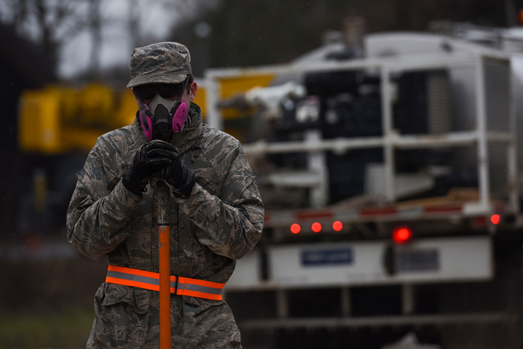 U.S. Air Force Senior Airman Jonathan Pike, 773rd Civil Engineer Squadron power production journeyman, rests during a Rapid Airfield Damage Repair training exercise on Ramstein Air Base, Germany, Jan. 25, 2018. The Airmen were tasked with filling six craters on a simulated runway. (U.S. Air Force photo by Senior Airman Devin M. Rumbaugh)
