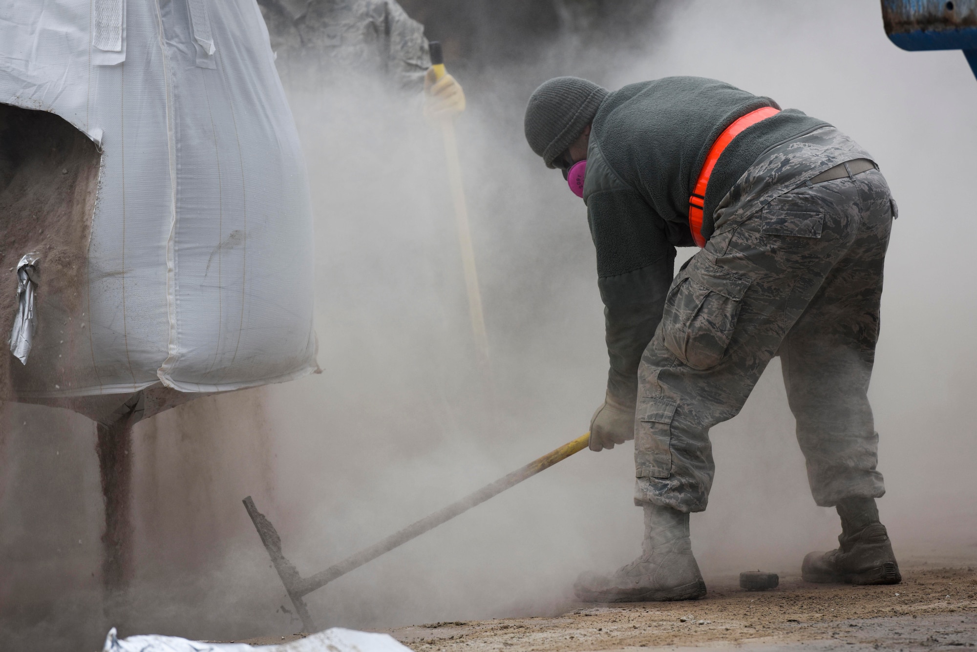 U.S. Air Force Staff Sgt. Antonio O’Campo, 773rd Civil Engineer Squadron electrical systems journeyman, mixes flowable fill concrete for a Rapid Airfield Damage Repair training exercise on Ramstein Air Base, Germany, Jan. 25, 2018. O’Campo was a part of the first class to be trained in the update RADR course. (U.S. Air Force photo by Senior Airman Devin M. Rumbaugh)