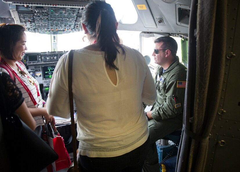 U.S. Air Force Maj. Chris McGravey, 535th Airlift Squadron gives a tour of the C-17 Globemaster III cockpit during the 2018 Singapore International Airshow, Changi Exhibition Centre, Singapore, Feb. 6, 2018