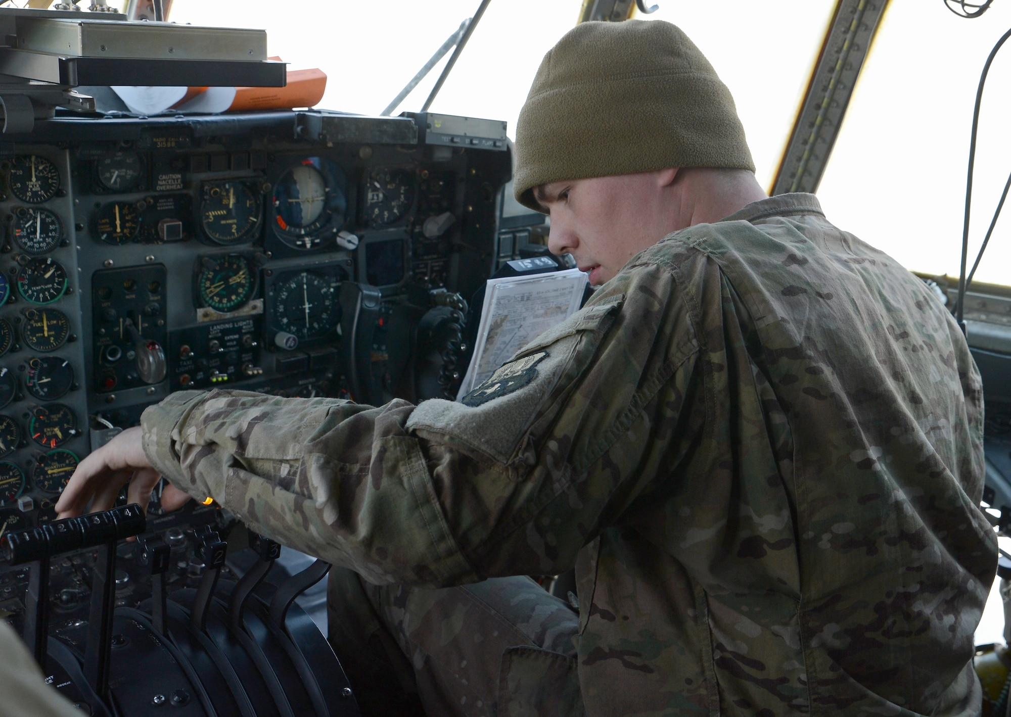 Senior Airman William Urquhart, 455th Expeditionary Aircraft Maintenance Squadron EC-130H Compass Call aerospace propulsion, checks engine functions on the EC-130H Feb. 2, 2018 at Bagram Airfield, Afghanistan.