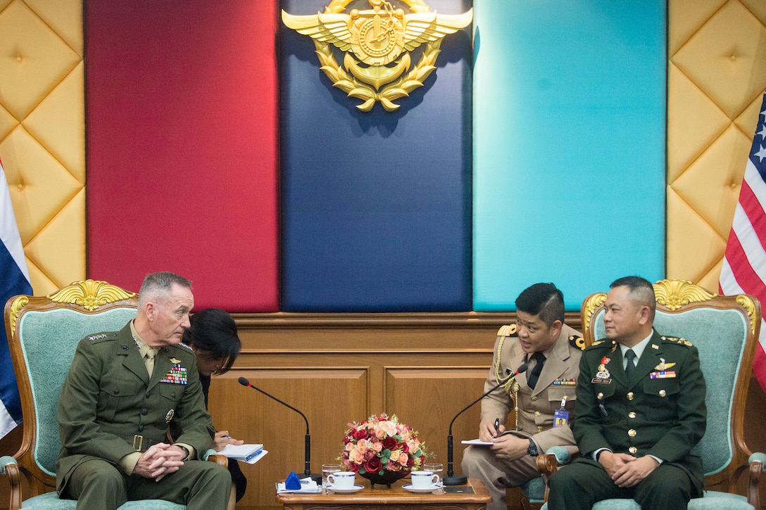 The chairman of the Joint Chiefs of Staff sits with a Thai army general.