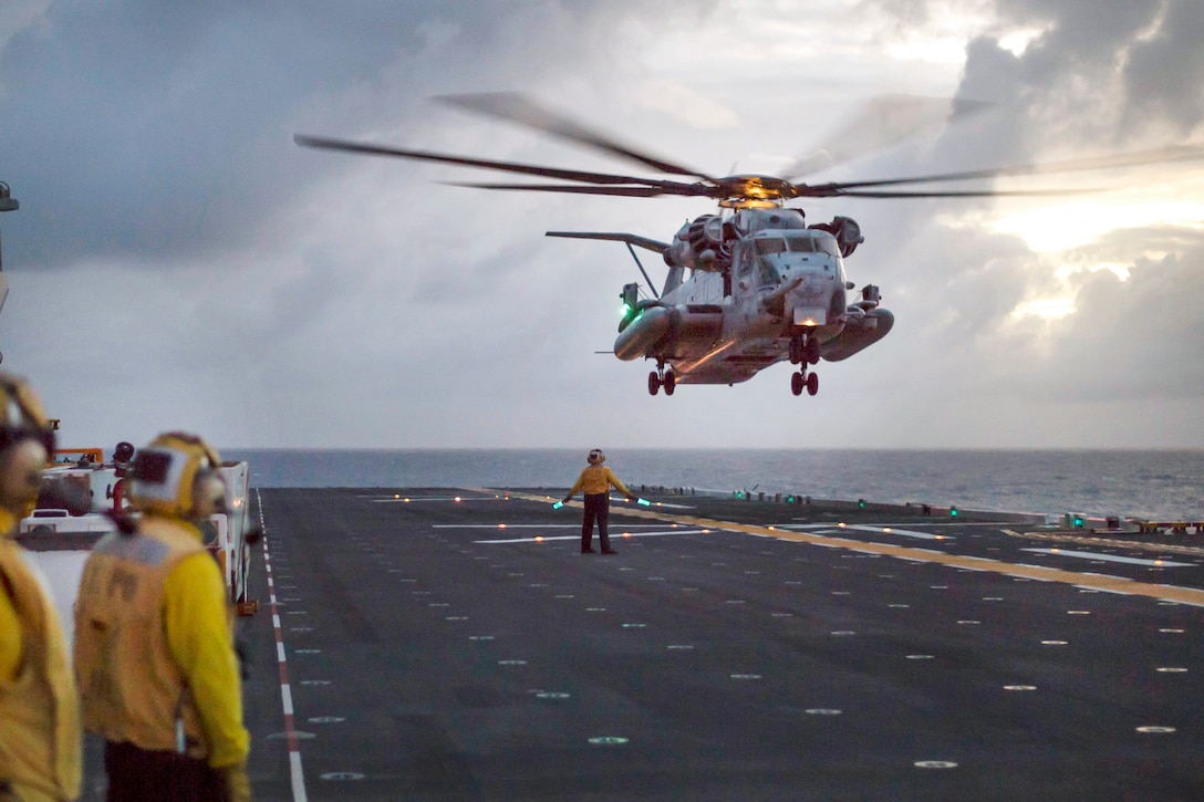 A CH-53E Super Stallion about to land on the flight deck of the amphibious assault ship USS Bonhomme Richard.