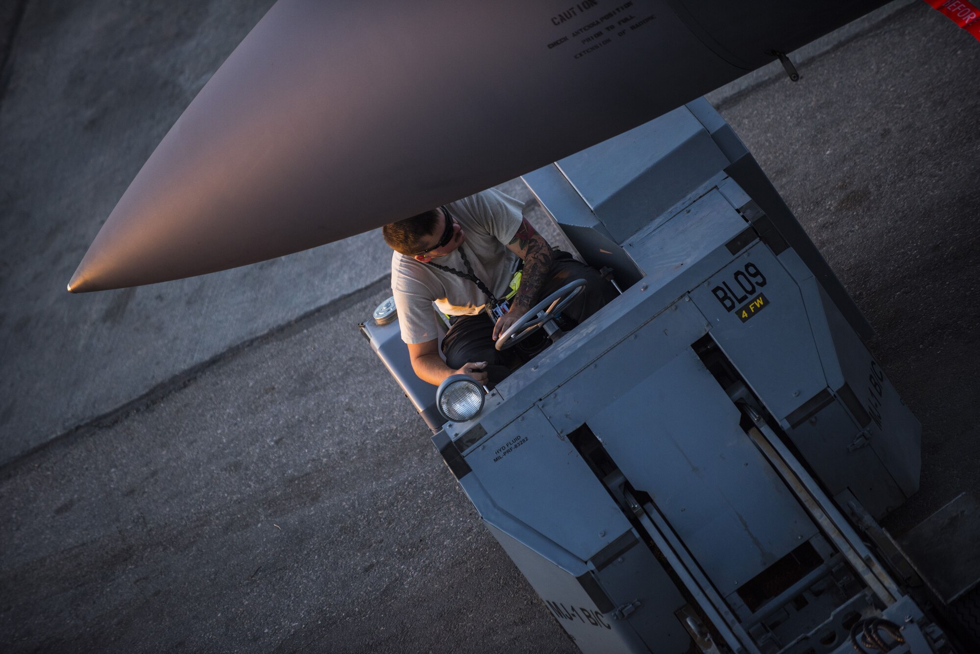 Senior Airman Andrew Rozycki, assigned to the 332d Expeditionary Maintenance Squadron, maneuvers a munitions loader beneath the nose of an F-15E Strike Eagle November 10, 2017 in Southwest Asia. During the year, the 332d Air Expeditionary Wing’s 1,056 aircraft weapons and maintenance personnel enabled a record setting air campaign against the Islamic State, which included more than 4,000 F-15E Strike Eagle combat sorties and more than 9,000 munitions expended. (U.S. Air Force photo by Staff Sgt. Joshua Kleinholz)