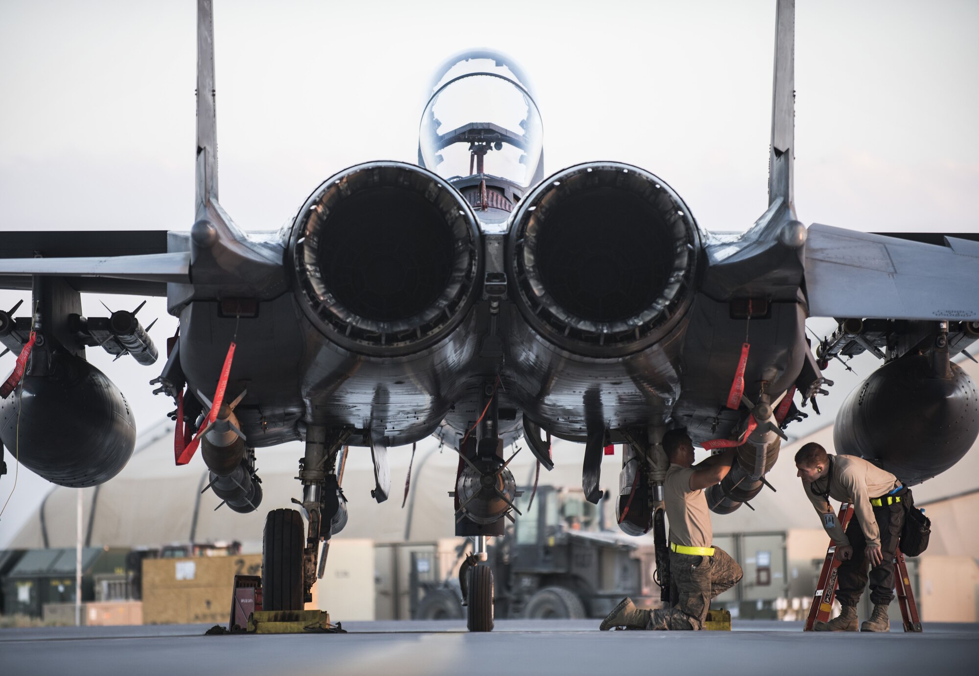 Airmen assigned to the 332d Expeditionary Maintenance Squadron check the placement of munitions beneath an F-15E Strike Eagle November 10, 2017 in Southwest Asia. The 332d Air Expeditionary Wing was recently awarded the 2017 Clements McMullen Memorial Daedalian Weapons System Maintenance Trophy, recognizing it as Air Combat Command’s premier large aircraft maintenance component. (U.S. Air Force photo by Staff Sgt. Joshua Kleinholz)