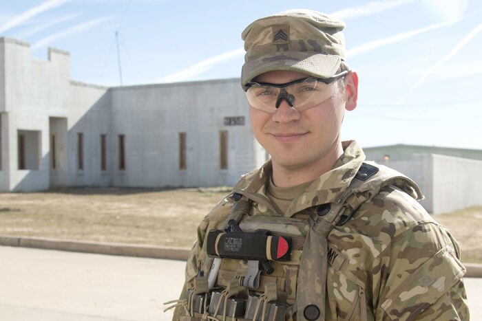 A soldier poses for a photograph.