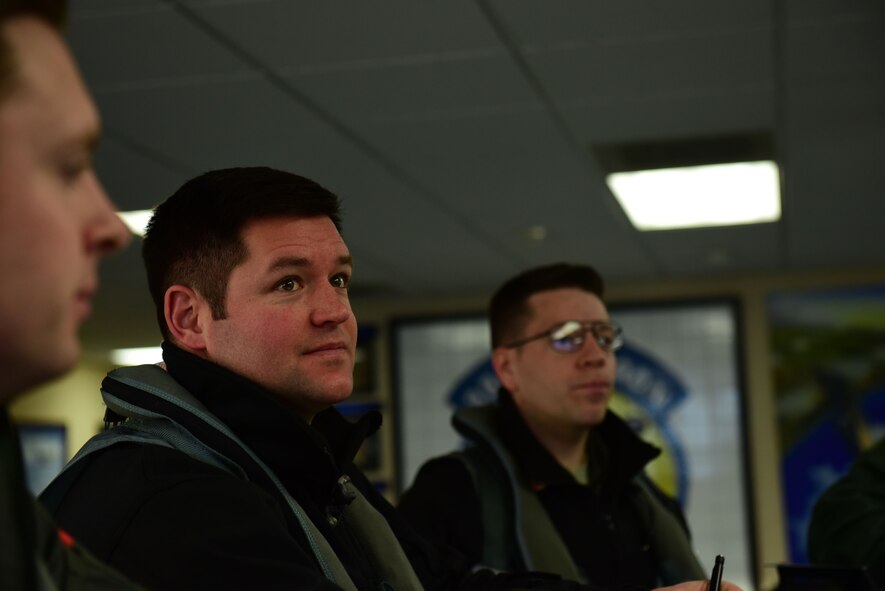 Maj. Wade Maulsby, 334th Fighter Squadron pilot, and 1st Lt. Mathew Clutts, 334th FS weapons systems operator, step to an F-15E Strike Eagle before flight, Feb. 5, 2018, at Seymour Johnson Air Force Base, North Carolina. Maulsby is the Air Combat Command nominee for the Colonel James Jabara Award for Airmanship. (U.S. Air Force photo by Airman 1st Class Kenneth Boyton)