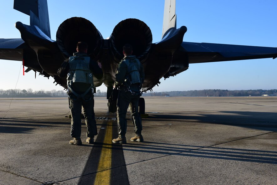 Maj. Wade Maulsby, 334th Fighter Squadron pilot, and 1st Lt. Mathew Clutts, 334th FS weapons systems operator, conduct a preflight check on an F-15E Strike Eagle, Feb. 5, 2018, at Seymour Johnson Air Force Base, North Carolina. Maulsby is the Air Combat Command nominee for the Colonel James Jabara Award for Airmanship, an award reserved for a U.S. Air Force Academy graduate whose accomplishments demonstrate superior performance in fields directly involved with aerospace vehicles. (U.S. Air Force photo by Airman 1st Class Kenneth Boyton)