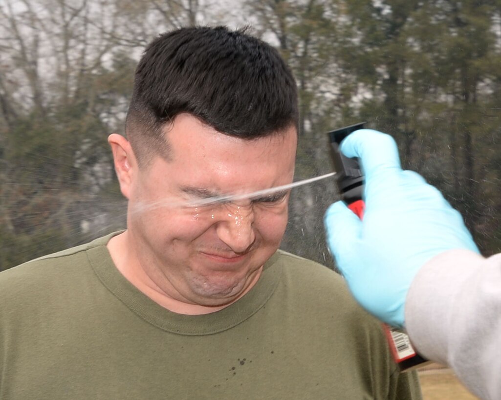 receives a blast of Oleoresin Capsicum spray, also known as pepper spray, during Security Augment Force training hosted by Marine Corps Police Department aboard Marine Corps Logistics Base Albany, Jan. 30.